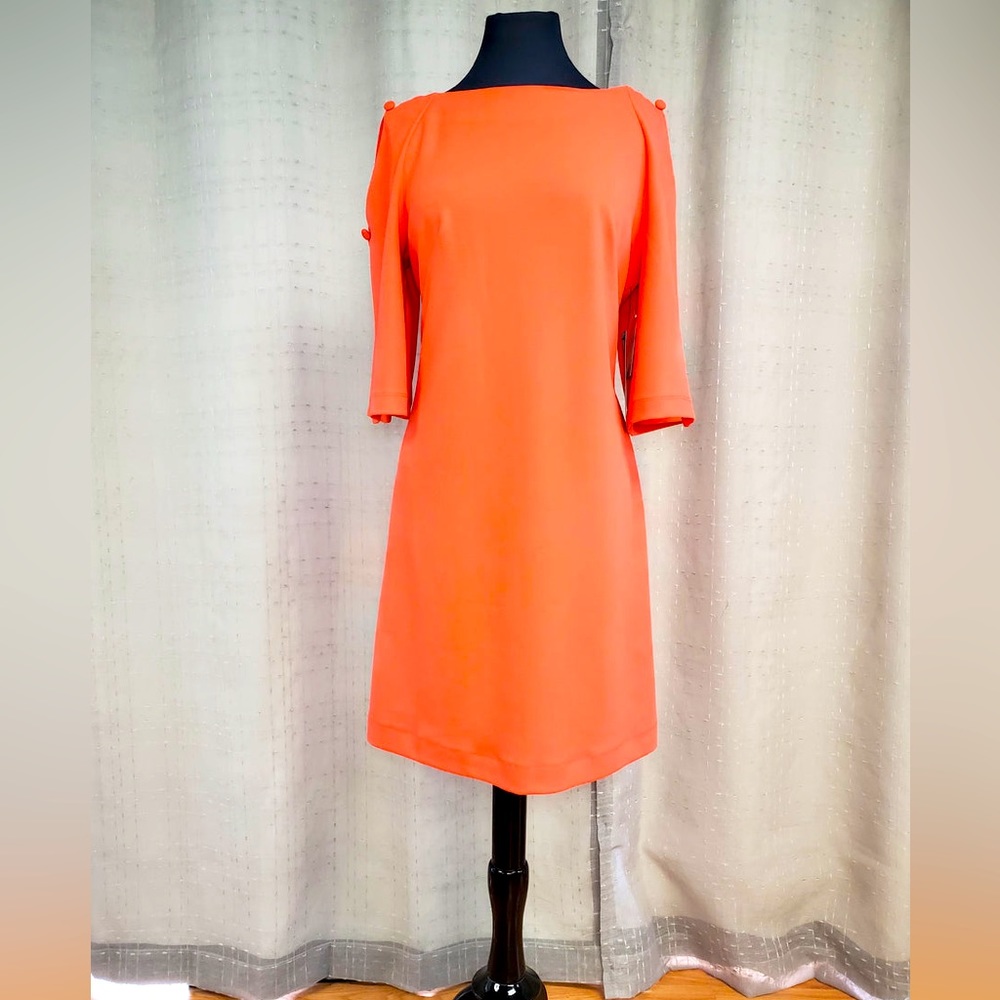 Coral mid length dress.